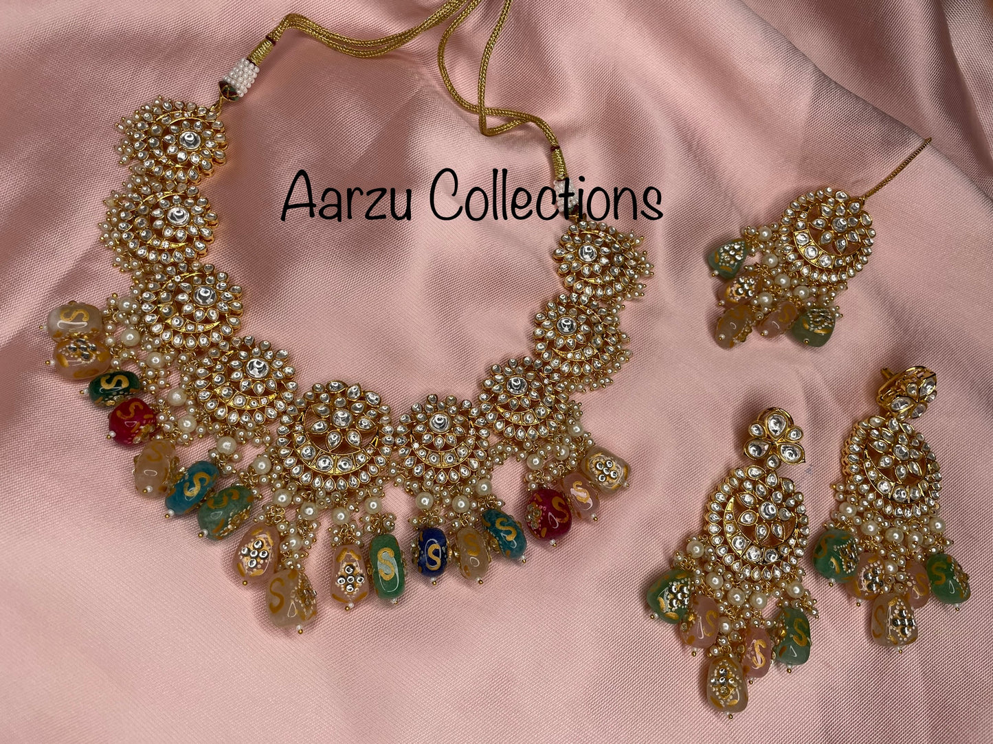 Designer inspired Kundan Necklace with hand painted quartz stones paired with statement earrings and tikka
