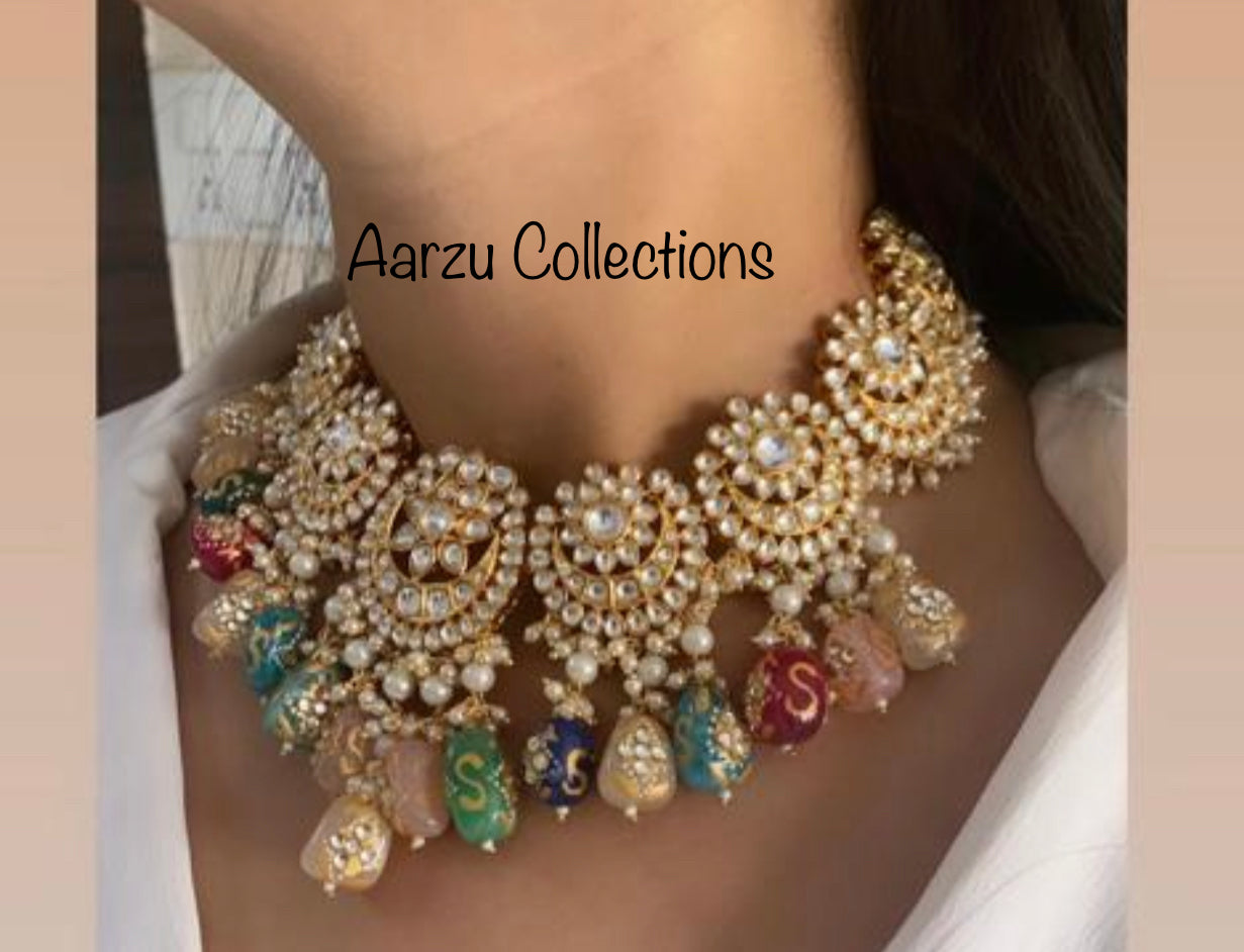Designer inspired Kundan Necklace with hand painted quartz stones paired with statement earrings and tikka