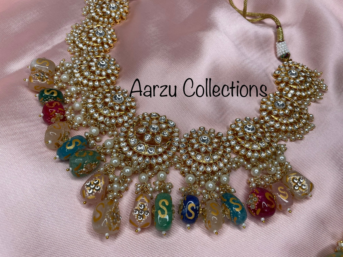 Designer inspired Kundan Necklace with hand painted quartz stones paired with statement earrings and tikka
