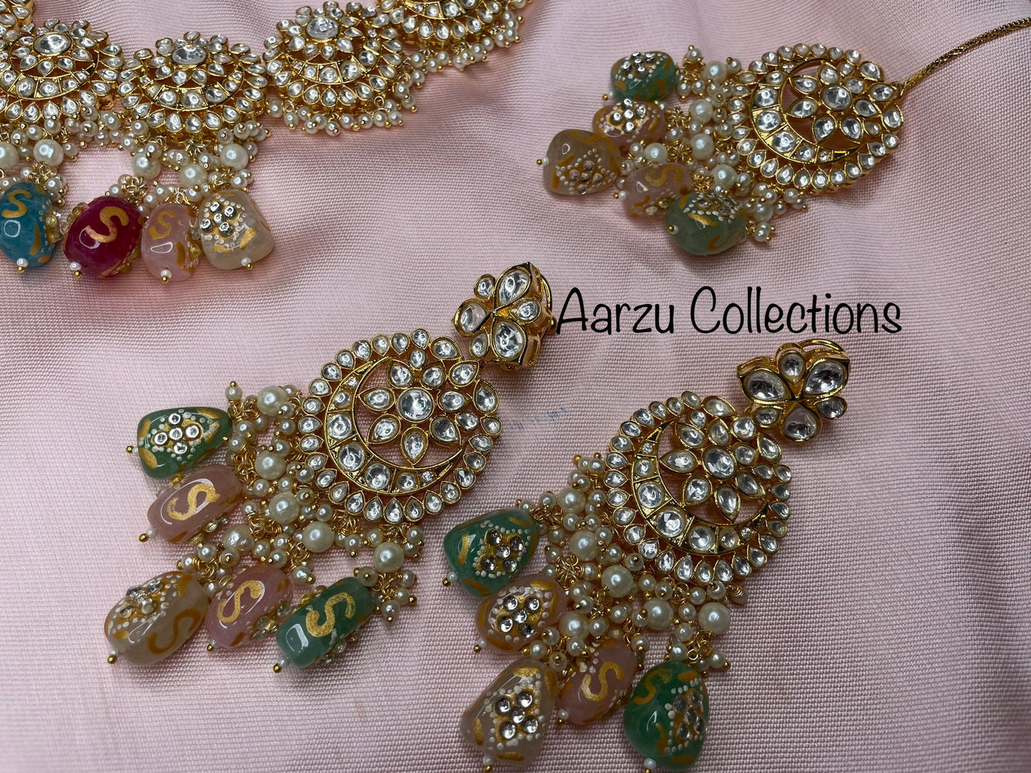Designer inspired Kundan Necklace with hand painted quartz stones paired with statement earrings and tikka
