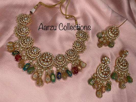 Designer inspired Kundan Necklace with hand painted quartz stones paired with statement earrings and tikka